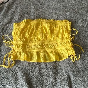 Free people yellow ruched side tie strapless top. Size L